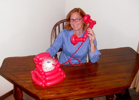Janice talking on a Balloon Phone
