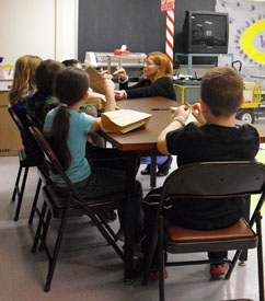 Janice helping students plan their Puppets